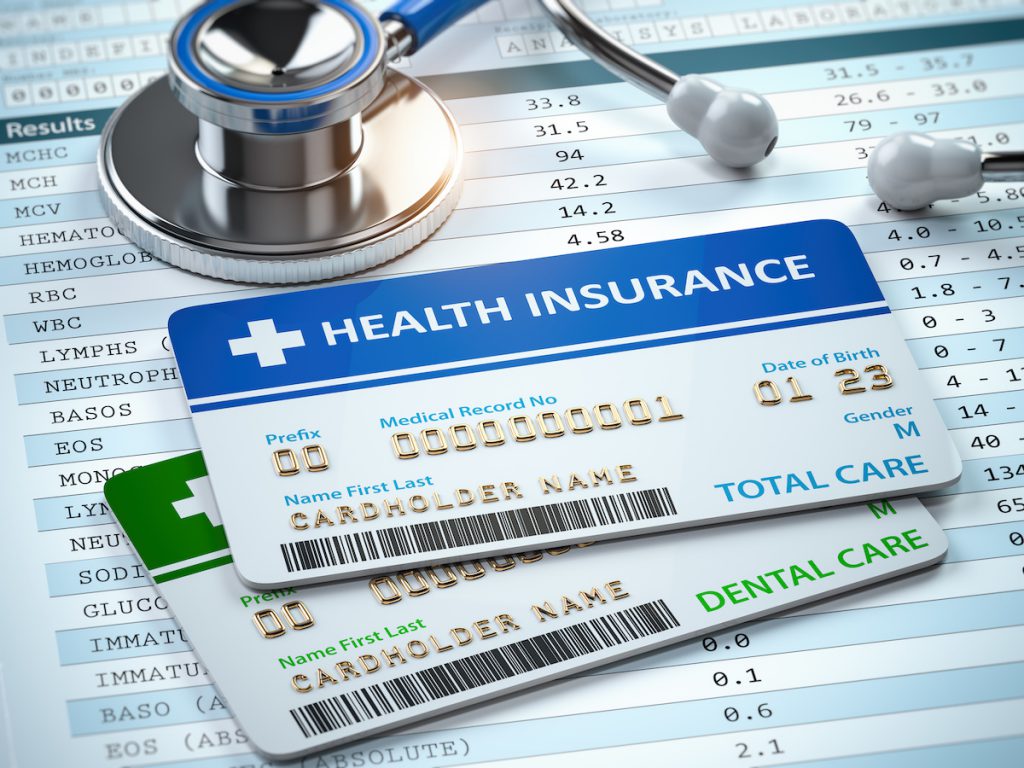 Health Insurance cards total and dental care with stethscope. Health Insurance cards total and dental care with stethscope. 3d illustration