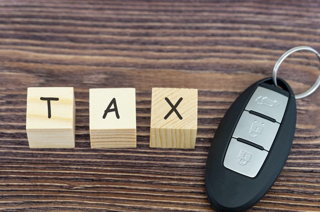 tax on cars, the inscription on wooden cubes and the key to the car