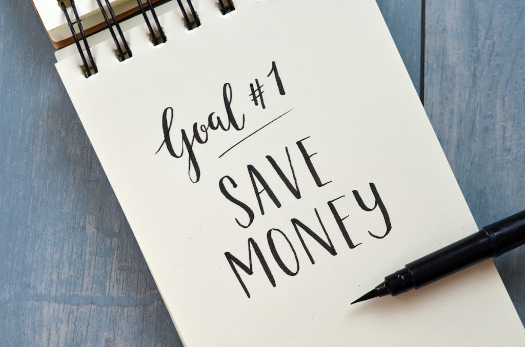 Goal No. 1 SAVE MONEY hand-lettered in notebook